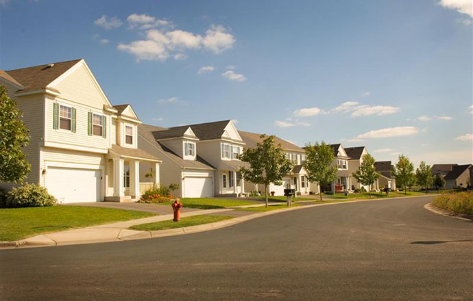 A row houses along a residential street.